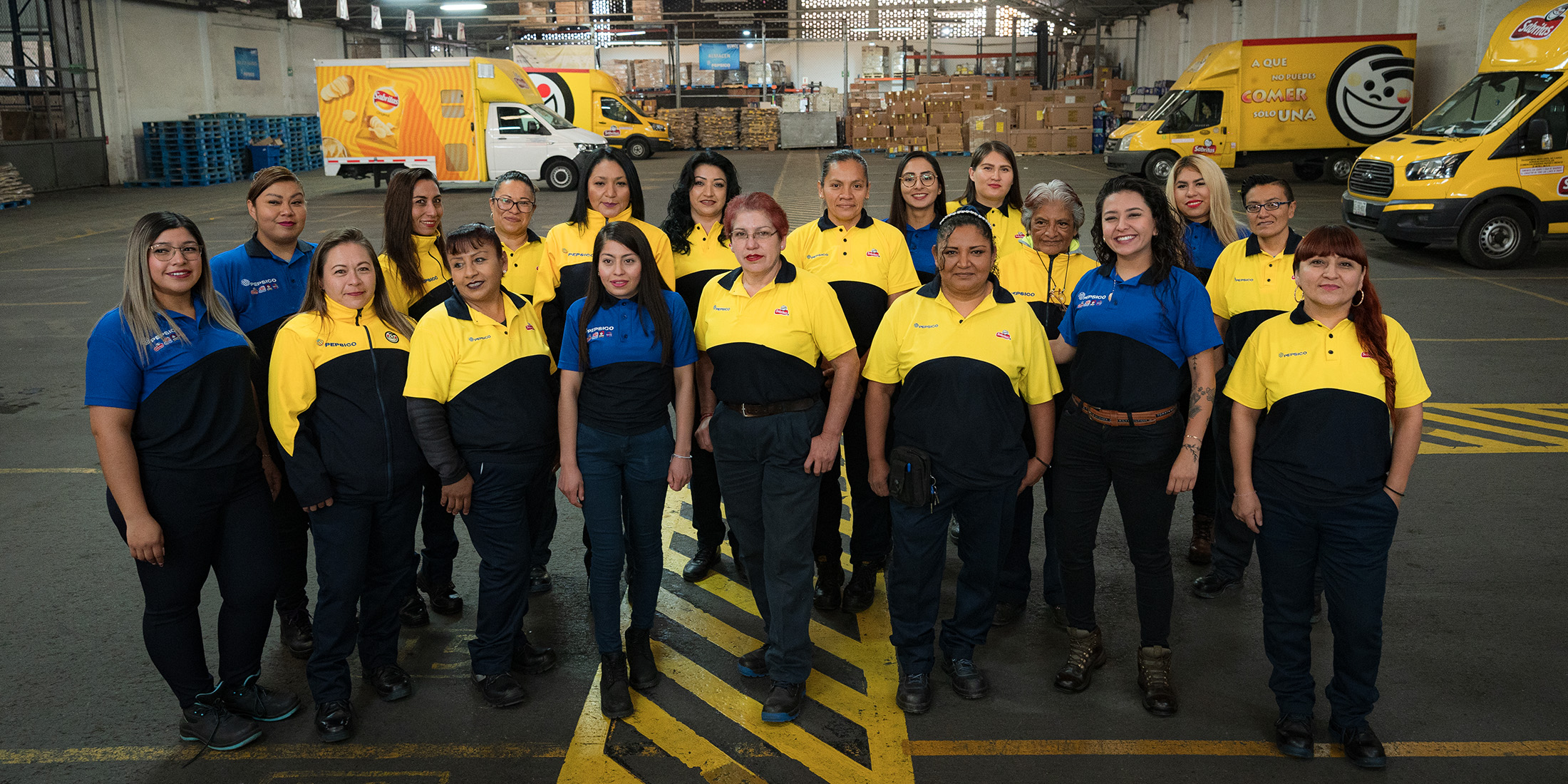 Associates standing together in a distribution center