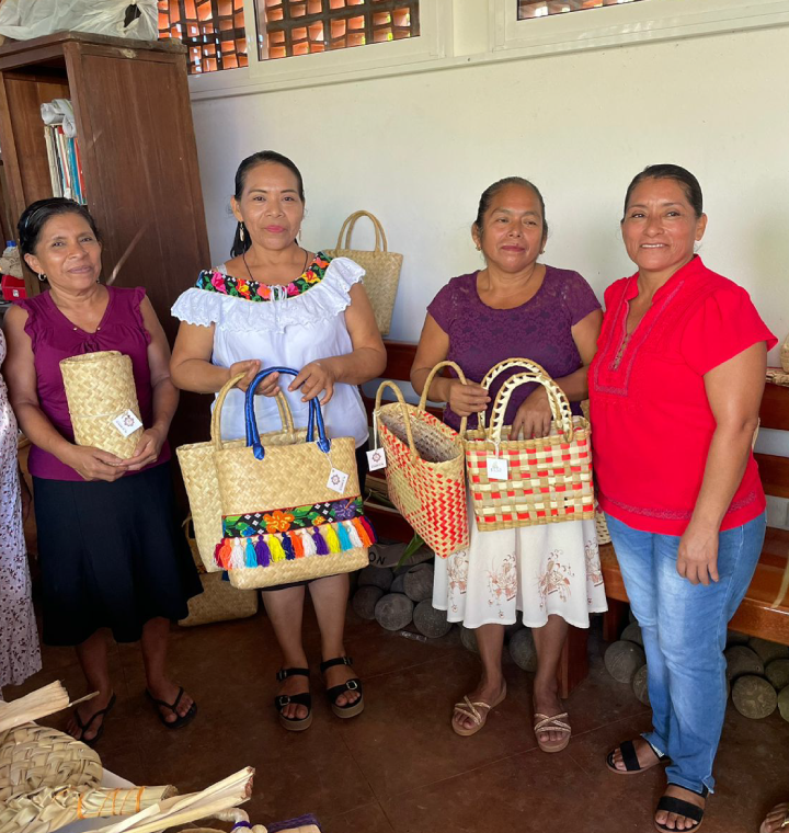 Women holding woven baskets